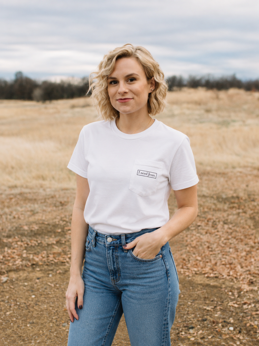I need Jesus. Pocket Logo Tee - Unisex