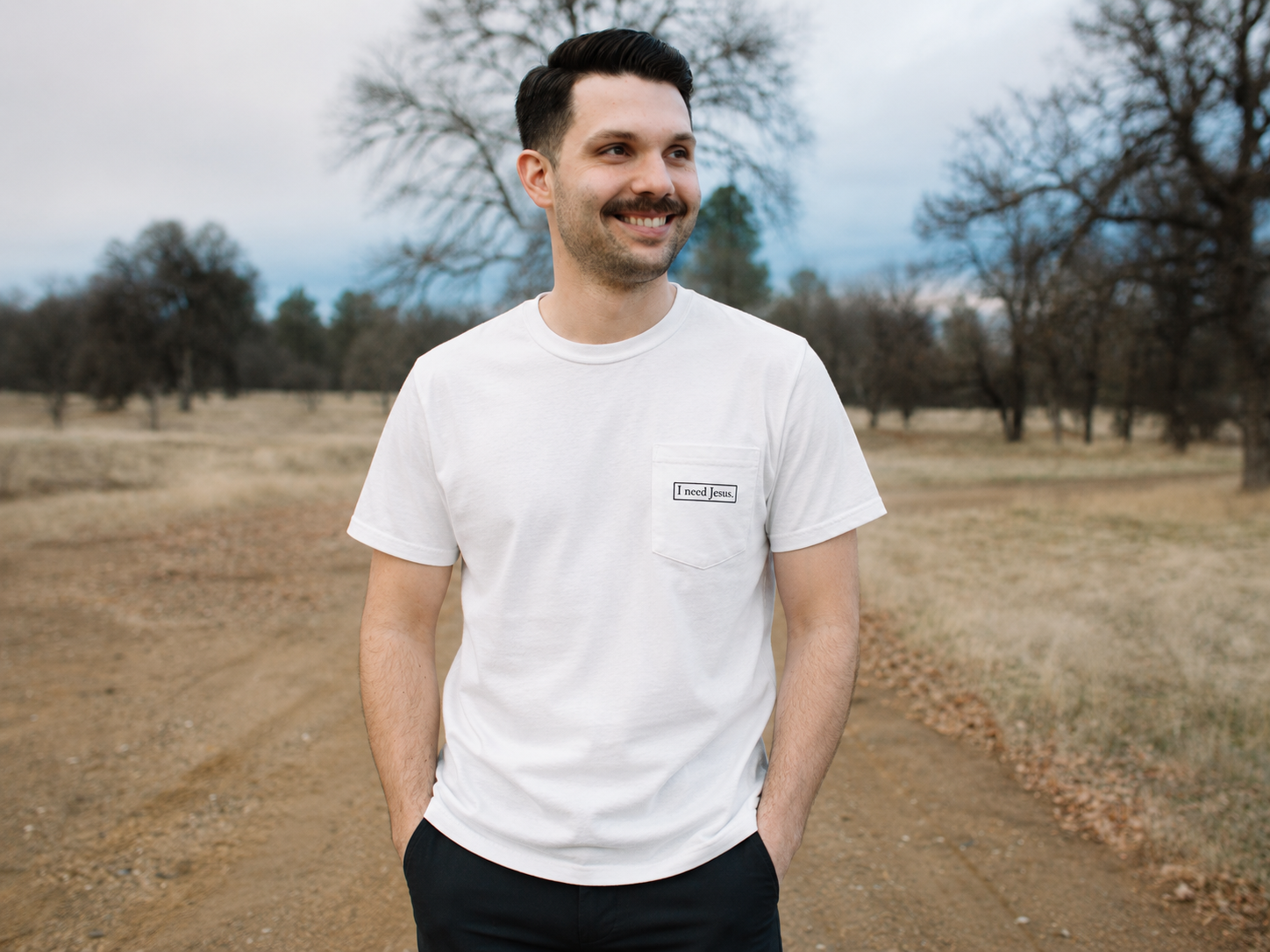 I need Jesus. Pocket Logo Tee - Unisex